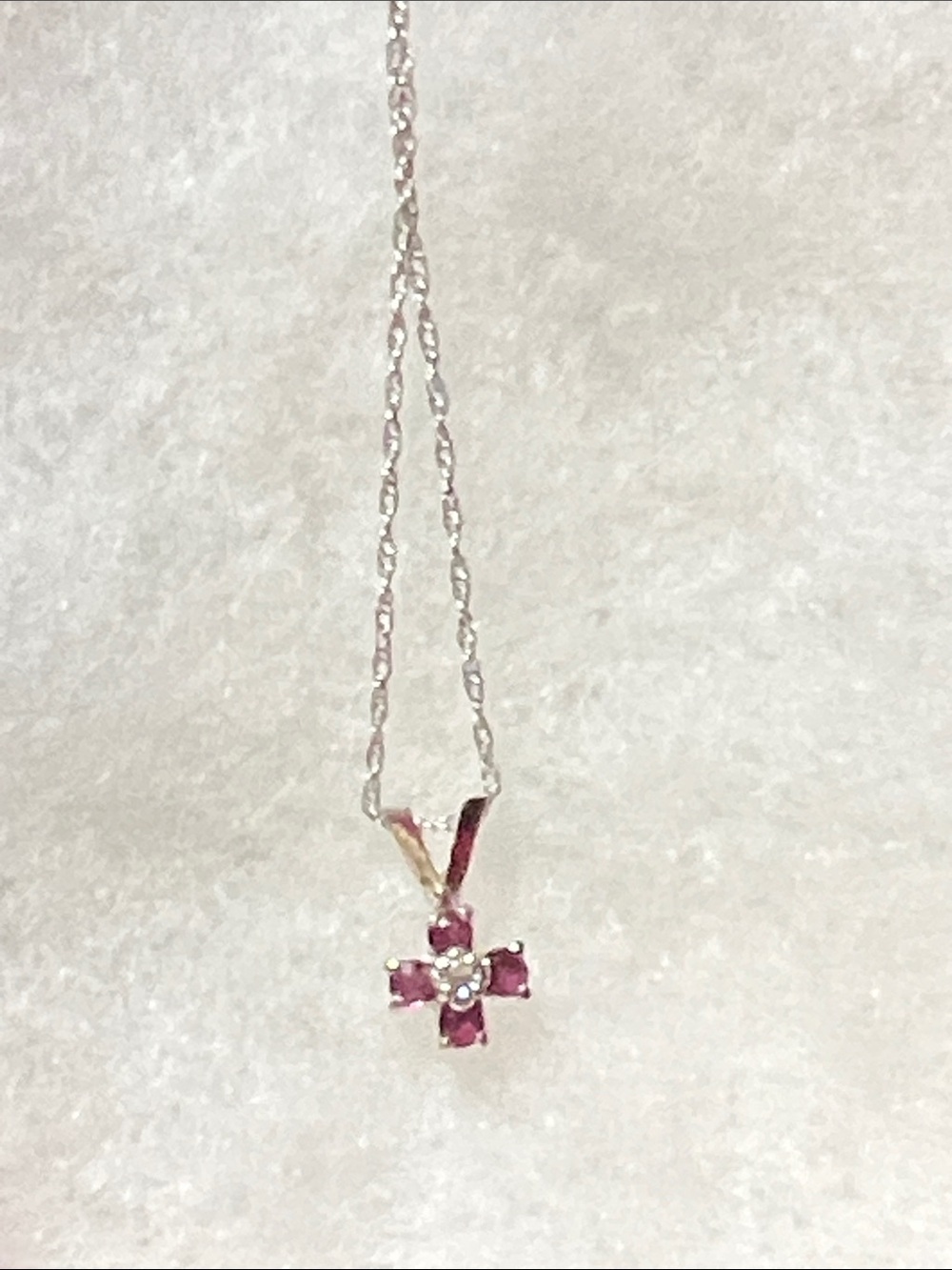 Delicate 10k white gold ruby, diamond necklace.